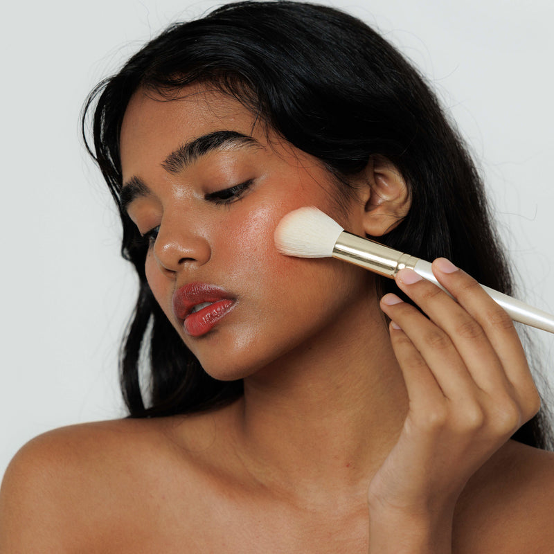 Blend with fingertips or a brush